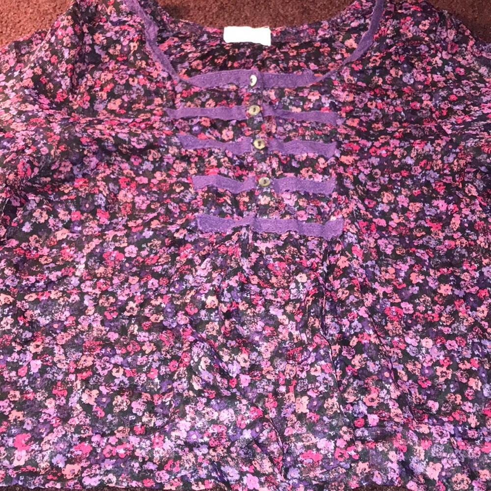 A black pink and purple t shirt